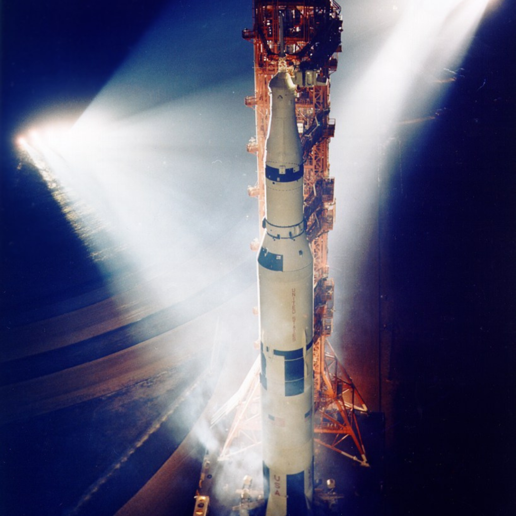 Apollo 13 Saturn V spotlit on the launch pad. Scan by Kipp Teague.